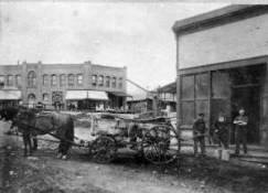 Horse and Wagon delivering water to a business around 1912