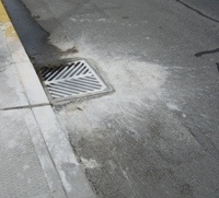 Storm drain with paint spill